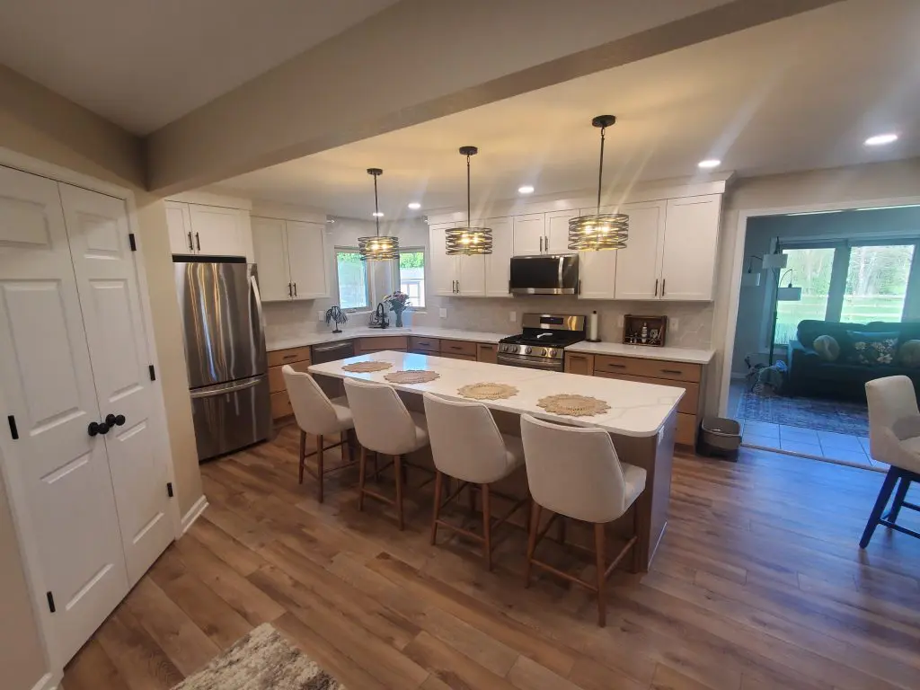 Overview of a recently renovated kitchen with white countertops and cabinets