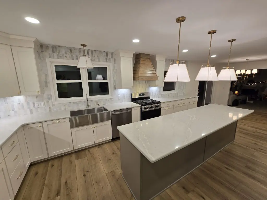 Recently renovated kitchen with modern countertops, cabinets and large island.