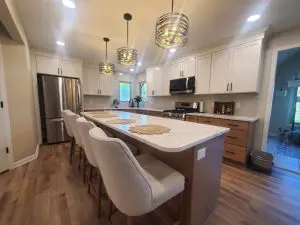 Recently remodeled kitchen with white countertops and white cabinets.