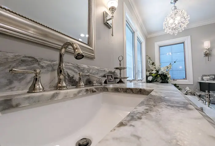 White granite sink in remodeled bathroom
