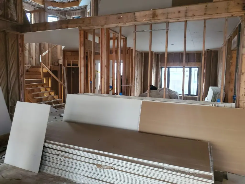 A home in the middle of a renovation process with materials stacked up.